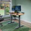 Electric Standing Desk with ComfortEdge in 48x30 Butcher Block in raised position at home